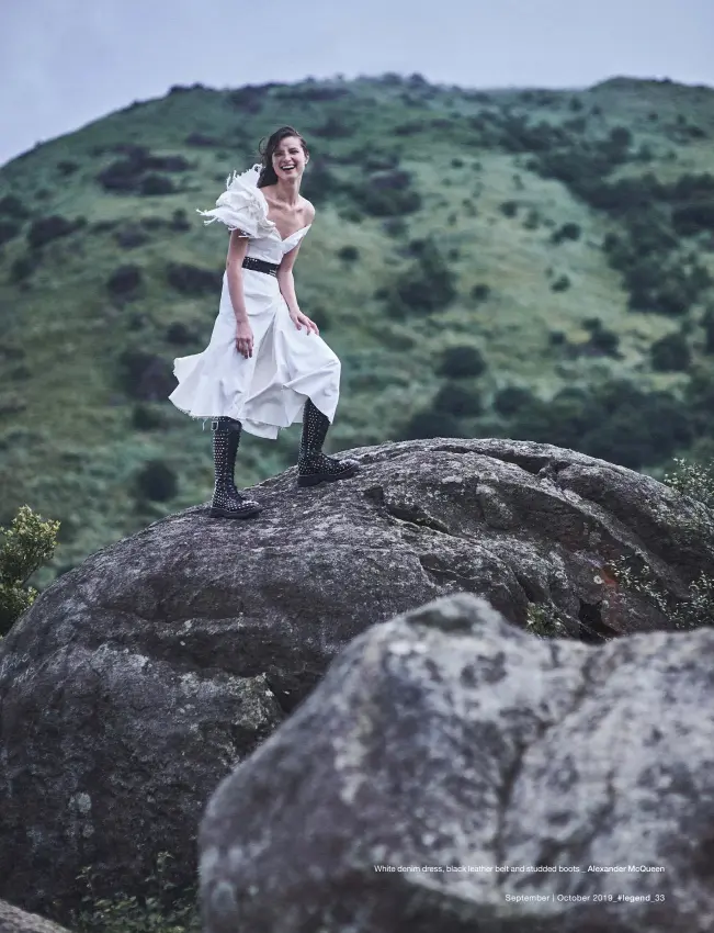  ??  ?? White denim dress, black leather belt and studded boots _ Alexander McQueen