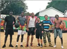  ?? PROVIDED TO CHINA DAILY ?? Liu Yimenghan (second from right) poses with his friends in Nairobi, Kenya.