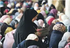  ?? AFP ?? Women praying at the historic Zaituna mosque in Tunis