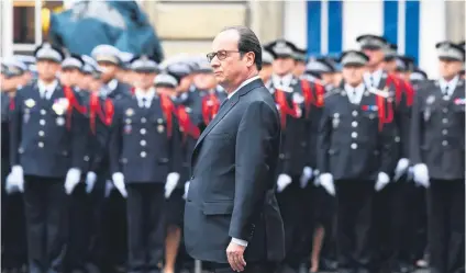  ?? Picture: AFP ?? TRIBUTE. French President Francois Hollande yesterday attends a ceremony honouring the policeman killed by a jihadist in an attack on the Champs Elysees.