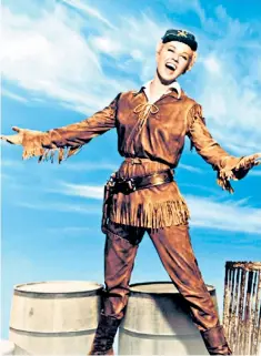  ??  ?? Doris Day in buckskin as the lead in Calamity Jane, and with Rock Hudson in Pillow Talk; when Hollywood became raunchier, she refused to make films involving what she called ‘naked bodies thrashing about’