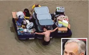  ?? AGENCIES PIX ?? Residents with their belongings wading through flood waters brought by Tropical Storm Harvey in Houston, Texas, on Wednesday. (Inset) Texas governor Greg Abbott.