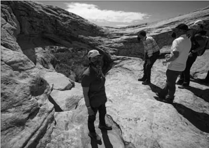  ?? AP Photo/Rick Bowmer, Pool ?? U.S. Interior Secretary Deb Haaland tours near ancient dwellings along the Butler Wash trail during a visit to Bears Ears National Monument on Thursday near Blanding, Utah.