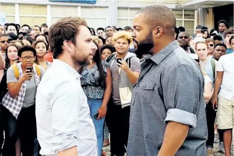  ?? SUPPLIED PHOTO ?? Charlie Day, left, and Ice Cube star in Fist Fight. The comedy establishe­s the wacky world of U.S. public education, but fails at developing character arcs.