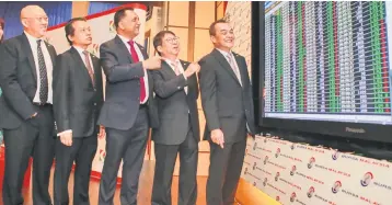  ??  ?? (From left) KIP REIT Management Sdn Bhd directors Foo Lee Khean and Dato Mohamed Arsad Sehan, chairman Datuk Dr Syed Hussain Syed Husman, managing director Datuk Chew Lak Seong, and executive director Dato’ Eric Ong Kook Liong look on during KIP REIT’s listing on Bursa Malaysia yesterday.