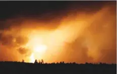  ?? Reuters ?? Smoke and flames rise from the Ukrainian defence ministry ammunition depot explosion in the eastern Chernihiv region, Ukraine. This still image is taken from a video yesterday.