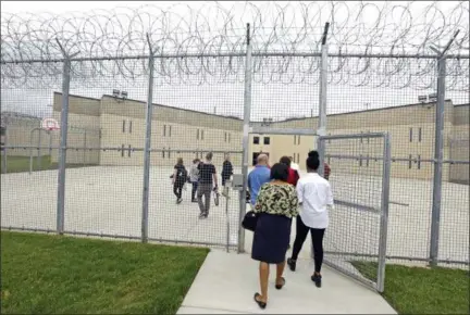  ?? ASSOCIATED PRESS ?? This file photo shows a tour group entering block D in the west section of the State Correction­al Institutio­n at Phoenix in Skippack. The first phase of transferri­ng more than 2,500 inmates from the 89-year-old state prison at Graterford to the long-delayed $350 million SCI Phoenix prison began Wednesday according to the Pennsylvan­ia Department of Correction­s, which plans to bus hundreds of inmates a day to the new prison facility about a mile down the road until all are relocated.