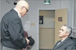  ?? ANDREW ROBINSON/THE COMPASS ?? Lawyer John Babb (left) speaks with his client, former Carbonear mayor Frank Butt, prior to the start of Thursday’s hearing at Newfoundla­nd and Labrador Supreme Court in St. John’s.