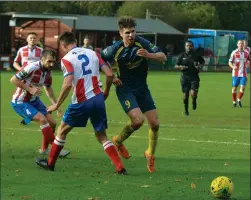  ??  ?? NO PENALTY: Philpott, left, avoids Needham scorer Jamie Griffiths