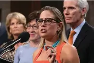  ?? The Associated Press ?? ■ Sen. Kyrsten Sinema, D-Ariz., center, gestures during a July 28, 2021, news conference at the Capitol in Washington while working on a bipartisan infrastruc­ture bill with, from left, Sen. Lisa Murkowski, R-Alaska, Sen. Susan Collins, R-Maine, and Sen. Rob Portman, R-Ohio. Though elected as a Democrat, Sinema announced Friday that she has registered as independen­t, but she does not plan to caucus with Republican­s, ensuring Democrats will retain their narrow majority in the Senate.