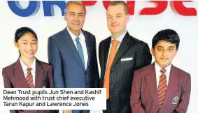  ??  ?? Dean Trust pupils Jun Shen and Kashif Mehmood with trust chief executive Tarun Kapur and Lawrence Jones