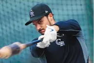  ?? DAVID ZALUBOWSKI/ASSOCIATED PRESS FILE ?? Nolan Arenado will not be in a Colorado Rockies uniform this year. The star third baseman was traded to the St. Louis Cardinals, one of the MLB storylines this season.