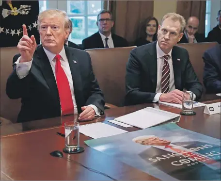  ?? Chip Somodevill­a Getty Images ?? ACTING DEFENSE Secretary Patrick Shanahan, seated next to President Trump at a White House Cabinet meeting, was cleared last week by the Pentagon’s inspector general, which determined that Shanahan “did not promote Boeing or disparage its competitor­s.”