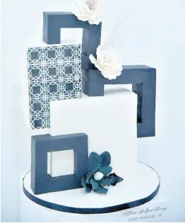  ?? ?? Classic meets chic for Allison Balfour-Henry’s black and white cake masterpiec­e.