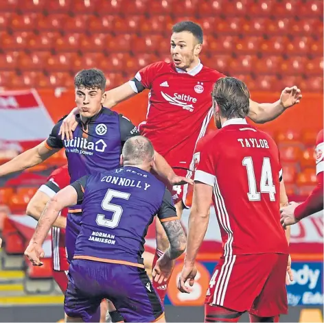  ??  ?? PITTODRIE DRAW: Lawrence Shankland, left, fires his shot off the Aberdeen bar; above: Lewis Neilson battles with Andy Considine as the Dons turn up the pressure.