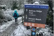  ?? HAVEN DALEY — THE ASSOCIATED PRESS ?? A person walks up a trail at snow-covered Mount Tamalpais State Park in Mill Valley on Friday.