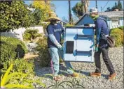  ?? Mel Melcon Los Angeles Times ?? A HEAT WAVE last summer led to rolling blackouts in parts of California. Above, solar panel installers.