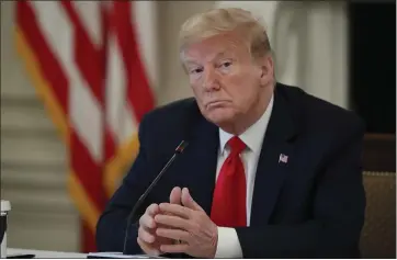  ?? ALEX BRANDON — THE ASSOCIATED PRESS ?? President Donald Trump speaks about reopening the country during a roundtable with industry executives on Wednesday in Washington. He hopes to travel to Arizona next week.