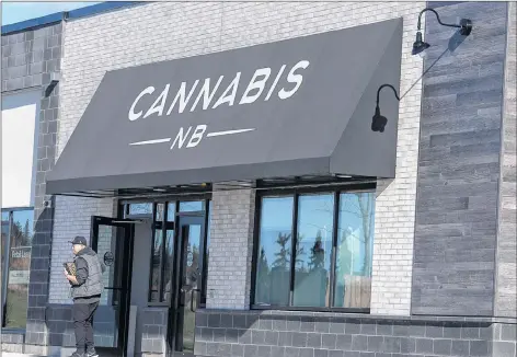  ?? CP PHOTO ?? When cannabis becomes legally available to buy today, residents can make their purchases at 20 Cannabis NB retail stores across the New Brunswick. An employee leaves the location in Rothesay, N.B., on Sunday.