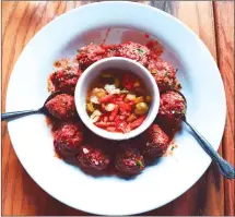  ??  ?? Meatballs at The Chop Shop, a mechanic’s-shop-turned-restaurant in the hipster neighbourh­ood of Wicker Park.