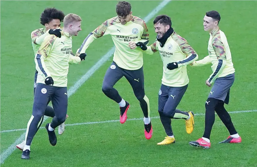  ??  ?? ↑
Manchester City players attend a training session on the eve of their Champions League round of 16 first leg match against Real Madrid in Manchester on Wednesday.
Agence France-presse