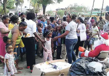  ??  ?? Children and parents gather to collect their toys at the Mayor’s annual treat on Wednesday.