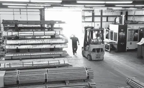  ?? Photos by Christophe­r Smith, For the Washington Post ?? A view of the warehouse at CNC Machine Products in Joplin, Mo. Most of the steel the company uses is imported so President Donald Trump’s new tariffs could kill the company.