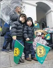  ??  ?? BROTHERS Leo, 4, left, and Beni Haigwood, 2, of Yuba City attend the rally with their mother, Ariana.