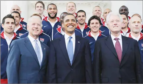  ?? (AP) ?? US President Barack Obama, flanked by Vice President Joe Biden, (left), and former president Bill Clinton, (right), pose for a photo with the US World Cup soccer team under the North Portico of the White House in Washington on May 27, 2010. Biden will share a stage with Obama and Clinton on March 28 in New York as he
raises money for his reelection campaign. It’s a one-of-a-kind political extravagan­za that will showcase decades of Democratic leadership.