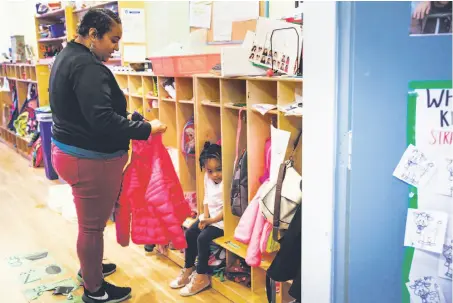  ?? Photos by Gabrielle Lurie / The Chronicle ?? Left: Kailey Norris carries daughter Khyla Robinson, 3, into preschool. Norris says a tax on imported goods would hit families hard. Below: Norris says goodbye to Khyla, who didn’t want her mother to leave.