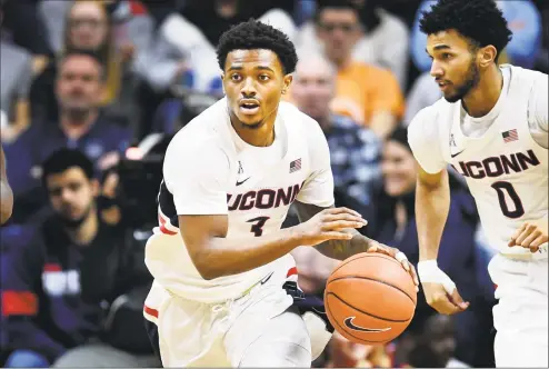  ?? Stephen Dunn / Associated Press ?? UConn’s Alterique Gilbert heads up court during the second half of against South Florida in February.