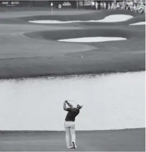  ?? David Goldman, The Associated Press ?? Paul Casey hits off the fairway of the 18th hole during the third round of the PGA Tour Championsh­ip at East Lake Golf Club in Atlanta on Saturday. He holds a two-shot lead going into Sunday’s play.