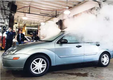  ?? AP ?? In this April 16, 2015 file photo, smoke created by water vapour billows out of the windows of a car, used by Colorado to fight stoned driving with youth demographi­cs, during a demonstrat­ion by the Colorado Department of Transporta­tion in southeast...