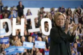  ?? ANDREW HARNIK — THE ASSOCIATED PRESS ?? Hillary Clinton claps after speaking at a rally at Cuyahoga Community College in Cleveland on Friday.