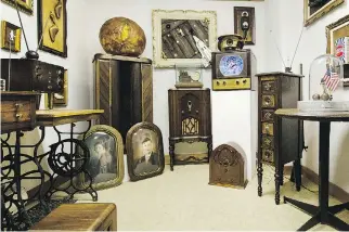  ??  ?? Marc Adornato’s studio features old radios, gramophone­s and an assortment of antique cameras.