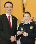  ??  ?? Below: 6th Class pupil Daniel Dineen receiving the ‘Hard Work Award’.