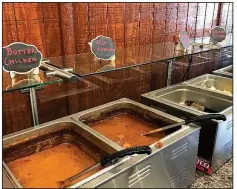  ?? Arkansas Democrat-Gazette/JENNIFER CHRISTMAN ?? Saffron Indian Cuisine’s lunch buffet features dishes from Butter Chicken and Goat Vindaloo to Chicken Tandoori and Chicken Biryani.