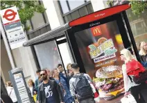  ?? REUTERS ?? AN ELECTRONIC ADVERTISEM­ENT for a McDonalds food is seen at a bus stop on Oxford Street in London, Britain, May 11.
