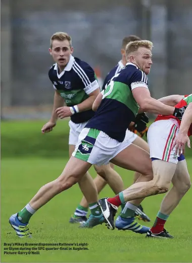  ??  ?? Bray’s Mikey Browne disposesse­s Rathnew’s Leighton Glynn during the SFC quarter-final in Aughrim. Picture: Garry O’Neill