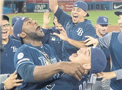  ?? FRED THORNHILL THE CANADIAN PRESS ?? The Rays clinched their first post-season berth since 2013 on Blue Jays turf. They’ll take on the A’s in Wednesday’s wild-card game.