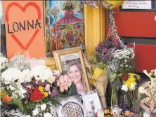  ?? David Zalubowski / Associated Press ?? A tribute is displayed outside the store owned by Tralona Bartkowiak, one of 10 victims in the shooting in Boulder, Colo.