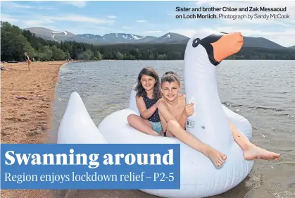  ?? Photograph by Sandy McCook ?? Sister and brother Chloe and Zak Messaoud on Loch Morlich.