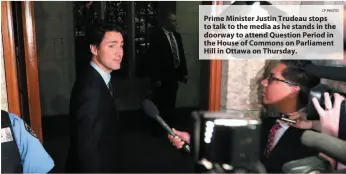  ?? CP PHOTO ?? Prime Minister Justin Trudeau stops to talk to the media as he stands in the doorway to attend Question Period in the House of Commons on Parliament Hill in Ottawa on Thursday.