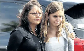  ?? JOE RAEDLE/ GETTY IMAGES ?? Mourners leave after the funeral of Alaina Petty on Monday at The Church of Jesus Christ of Latter- day Saints in Coral Springs, Fla. Petty, a 14- year- old student at Marjory Stoneman Douglas High School, was one of 17 people killed in Wednesday’s...