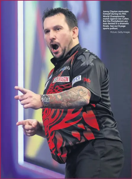  ?? Picture: Getty Images ?? Jonny Clayton motivates himself during his PDC World Championsh­ip match against Joe Cullen. But the Pontyberem ace was denied in a dramatic finale. See our 8-page sports pullout.