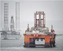  ?? GETTY IMAGES ?? Investment in new technology has allowed Britain to cut oil production costs and boost reserves. Above, North Sea oil rigs.