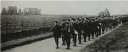  ?? T.L. FULLER ?? Canadian soldiers march pass Stonehenge during their training at Salisbury Plain. Photograph­er Thomas Fuller took many pictures of soldiers going through their daily routines.