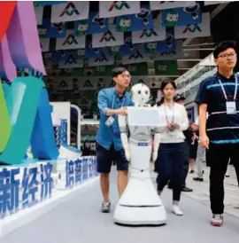  ??  ?? October 12, 2016: A robot at the National Mass Entreprene­urship p and Innovation Week in Shenzhen. Xinhua