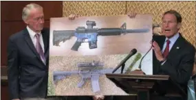  ?? ASSOCIATED PRESS ?? Sen. Edward Markey, D-Mass., left, and Sen. Richard Blumenthal, D-Ct., display a photo of a plastic gun on July 31 on Capitol Hill in Washington. Democrats are calling on President Donald Trump to reverse an administra­tion decision to allow a Texas...
