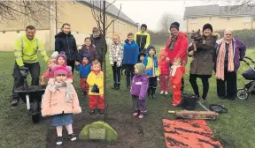  ??  ?? Planting Stirling Council land services, school pupils, Cambusbarr­on Community Council, Greener Cambusbarr­on and village residents all helped to plant the trees